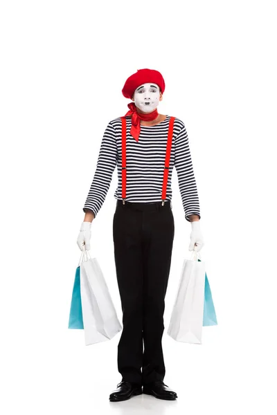 Pantomime steht mit Einkaufstaschen isoliert auf weißem Grund — Stockfoto