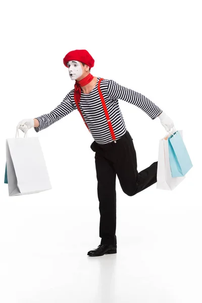 Mime running with shopping bags isolated on white — Stock Photo