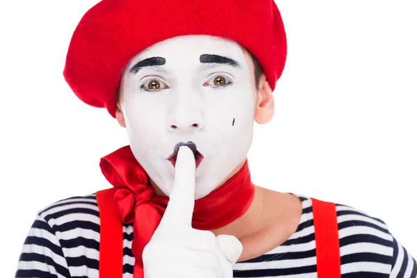 Portrait of mime showing silence gesture isolated on white — Stock Photo