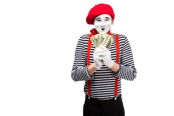 Glücklich Pantomime hält Dollars isoliert auf weiß — Stockfoto