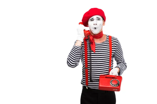 Mime talking by stationary telephone isolated on white — Stock Photo