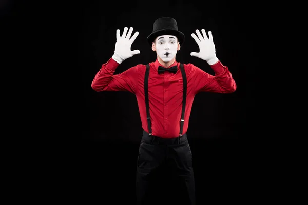 Mime with hands up isolated on black — Stock Photo