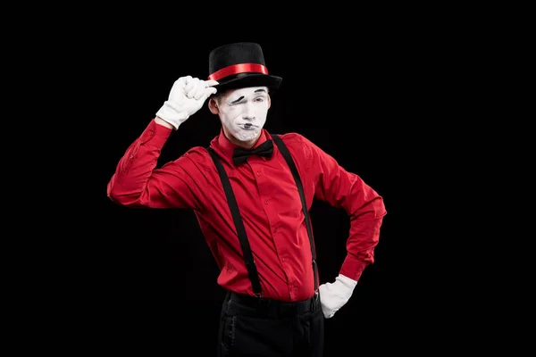 Mime winking and greeting with hat isolated on black — Stock Photo