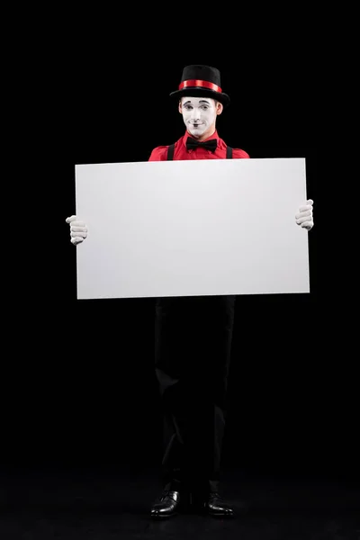 Mime holding empty board isolated on black — Stock Photo