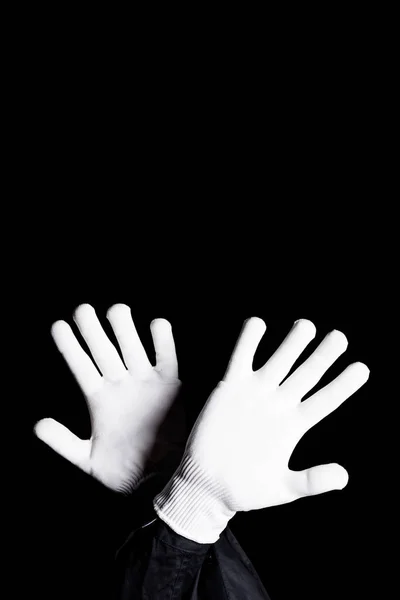 Обрезанное изображение мима, показывающее знак блока, изолированный на черном — стоковое фото