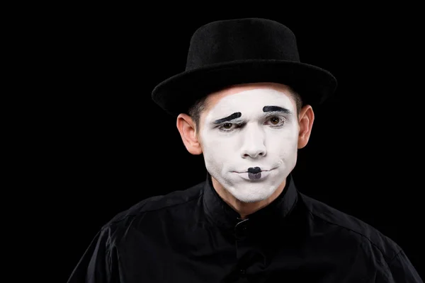 Confused mime looking at camera isolated on black — Stock Photo