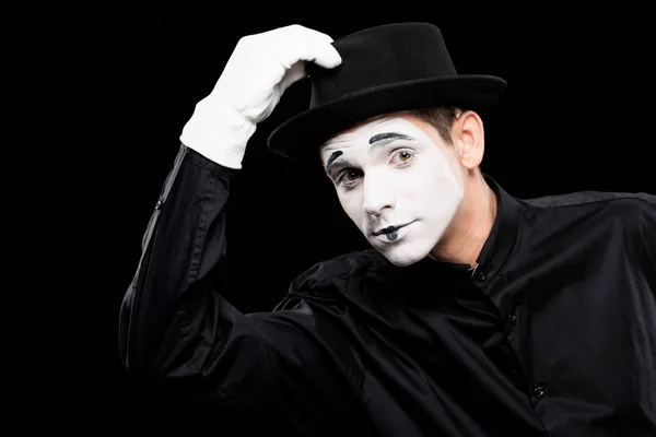 Mime greeting and touching hat isolated on black — Stock Photo