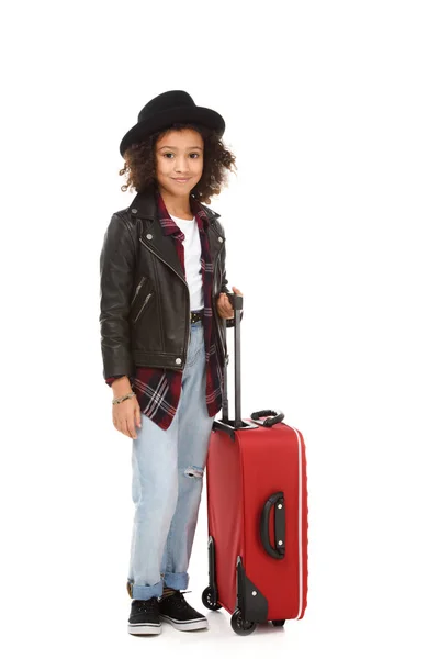 Happy little child in stylish clothing with suitcase isolated on white — Stock Photo