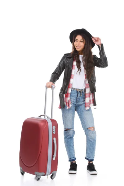 Happy young woman with luggage isolated on white — Stock Photo