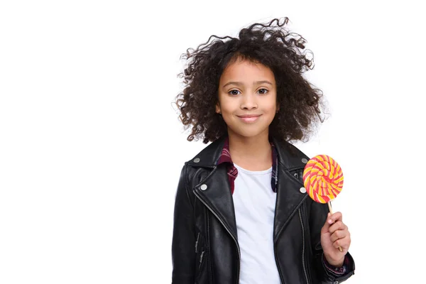 Beautiful little child in leather jacket with lollipop isolated on white — Stock Photo