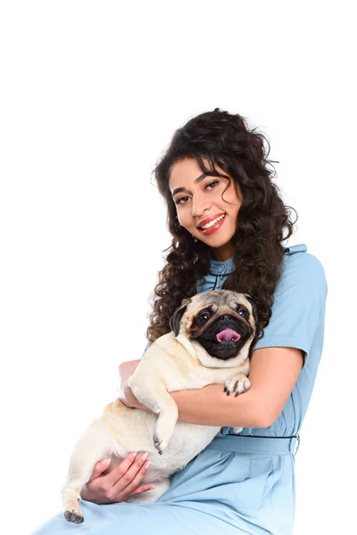 Beautiful young woman holding adorable pug isolated on white — Stock Photo