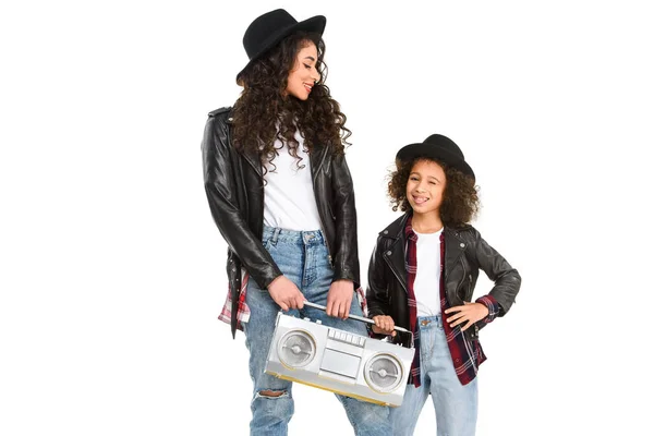 Happy mother and daughter with retro boombox isolated on white — Stock Photo