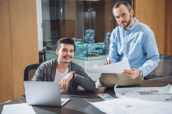 Creative designers working on project together at modern office — Stock Photo