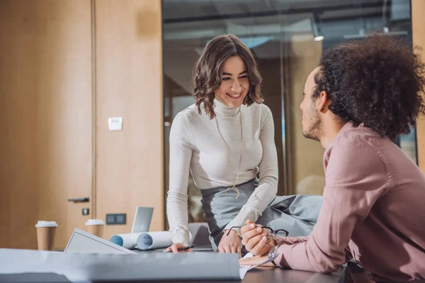 Young architects working together at office and chatting — Stock Photo