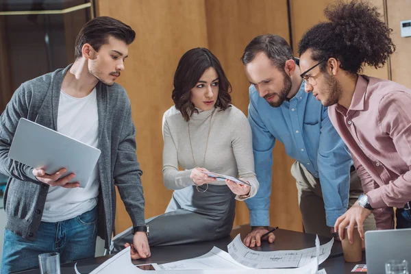 Group of successful architects working together at modern office — Stock Photo