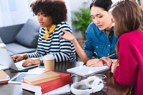 Multicultural group of young students studying together — Stock Photo
