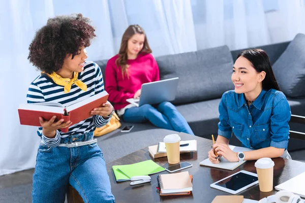 Multicultural group of young students studying together — Stock Photo