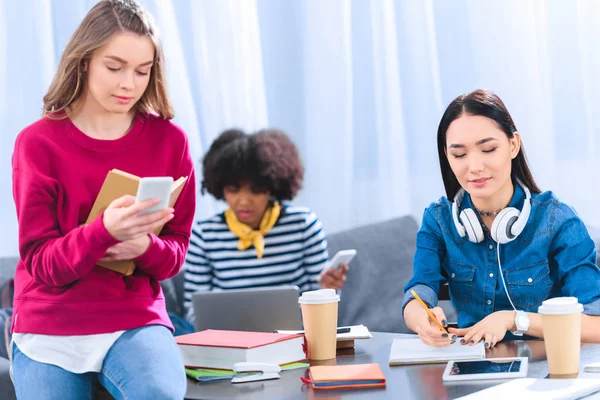 Multicultural group of young students studying together — Stock Photo