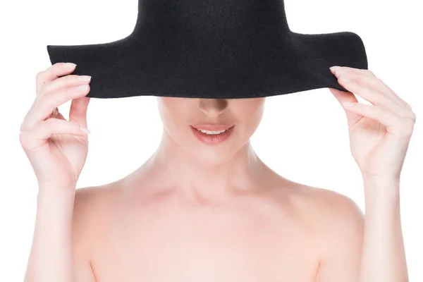 Woman with partly hidden face under hat isolated on white — Stock Photo