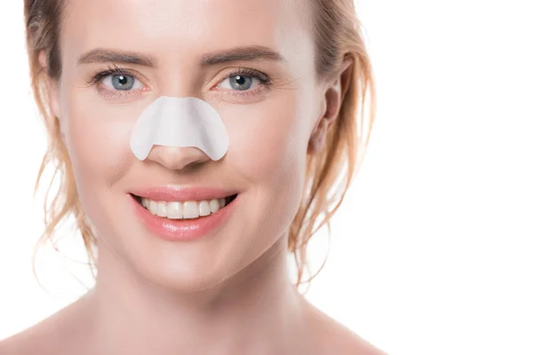 Femme avec bande nasale isolée sur blanc — Photo de stock