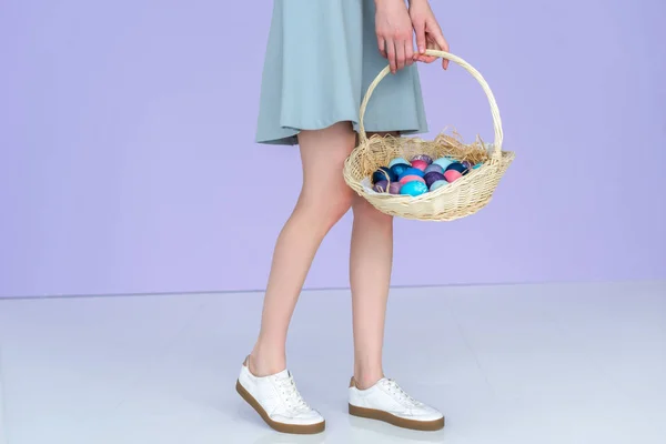 Cropped view of woman holding painted Easter eggs — Stock Photo