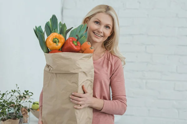 Woman with vegetables — Stock Photo