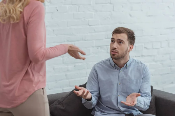 Partial view of mother and grown son having an argument at home — Stock Photo