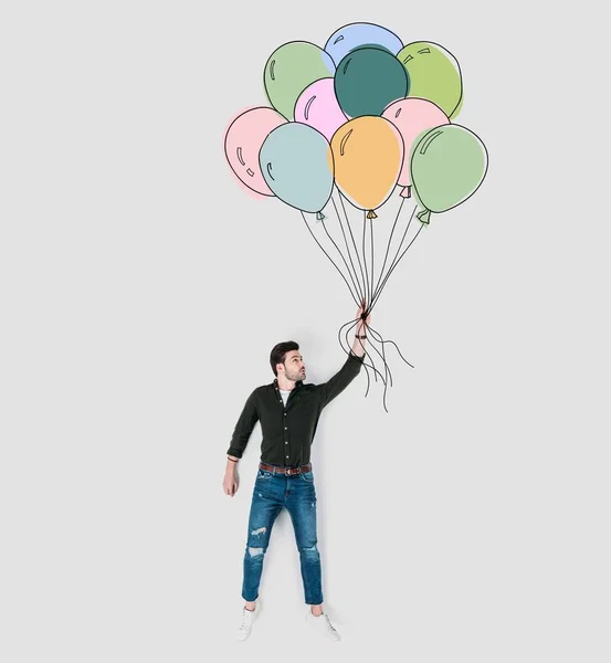 Creative hand drawn collage with man holding colorful balloons — Stock Photo