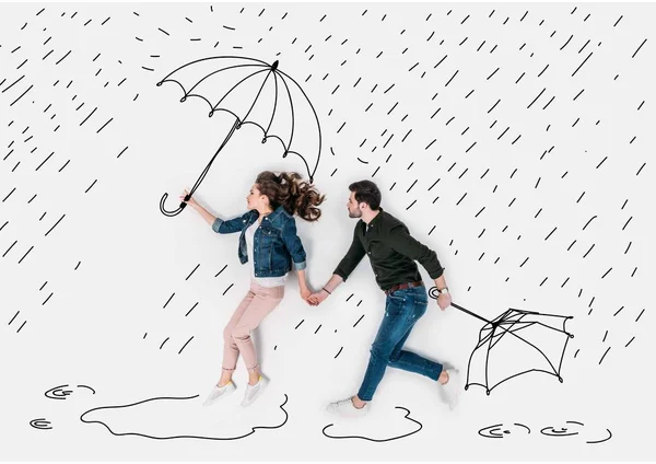 Creative hand drawn collage with couple running under rain with umbrellas — Stock Photo