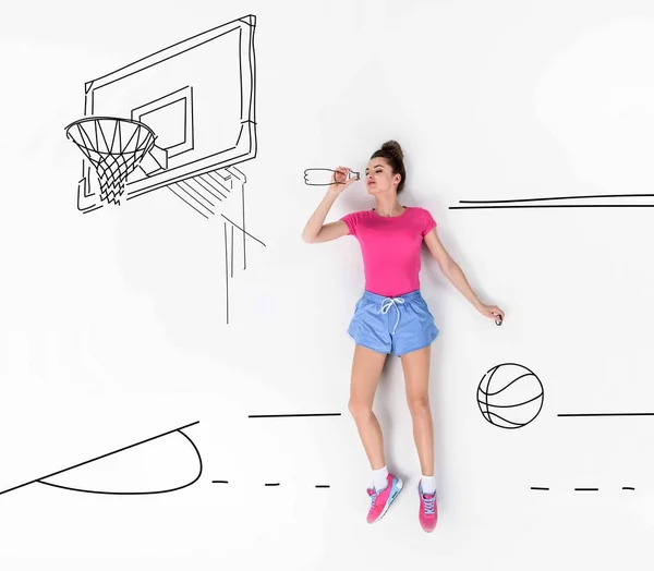 Creative hand drawn collage with drinking water on basketball field — Stock Photo