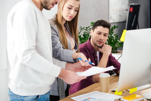 Partial view of business people discussing new marketing strategy at workplace in office — Stock Photo