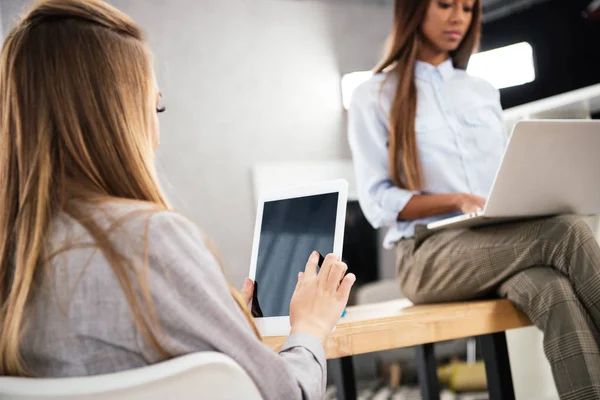 Partial view of multicultural businesswomen working in office — Stock Photo