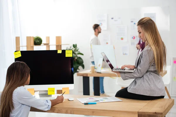 Partial view of multicultural businesswomen working in office — Stock Photo