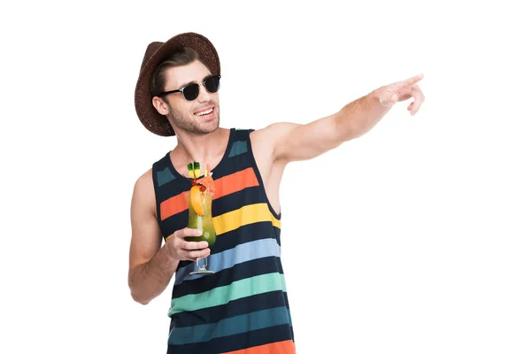 Man with cocktail drink pointing somewhere, isolated on white — Stock Photo
