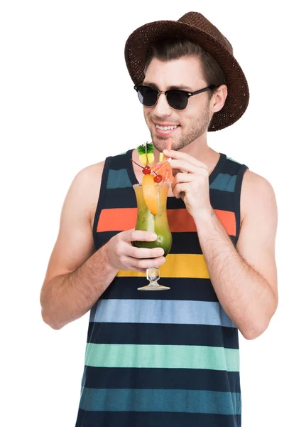 Man in sunglasses drinking cocktail, isolated on white — Stock Photo