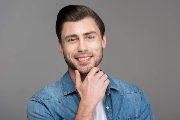 Portrait of handsome smiling man, isolated on grey — Stock Photo