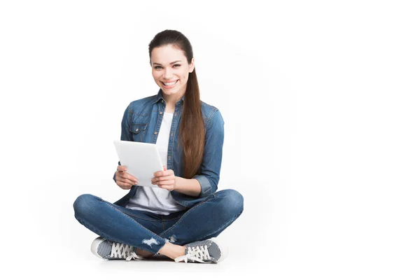 Beautiful cheerful girl using tablet, isolated on white — Stock Photo