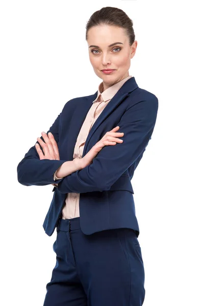 Beautiful adult businesswoman with crossed arms looking at camera isolated on white — Stock Photo