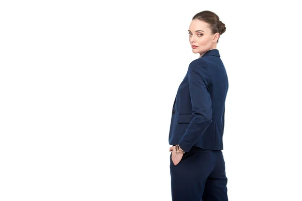 Mujer de negocios adulto elegante volver atrás y mirando a la cámara aislada en blanco - foto de stock