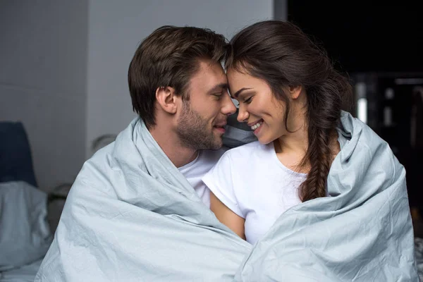 Young man embracing his attractive wife — Stock Photo