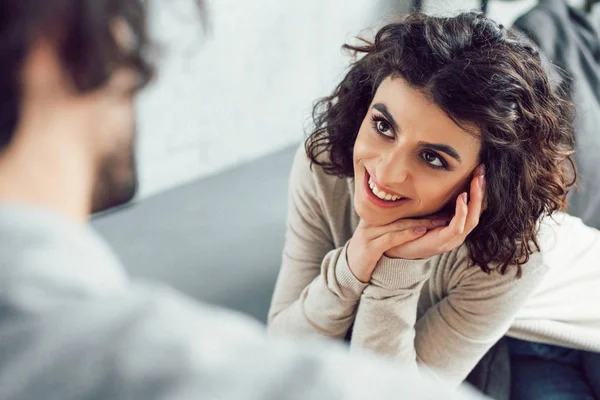 Cropped image of smiling girlfriend looking at boyfriend at home — Stock Photo