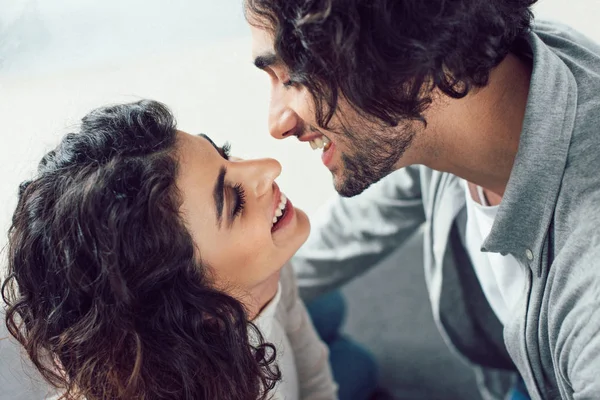 Young couple going to kiss at home — Stock Photo