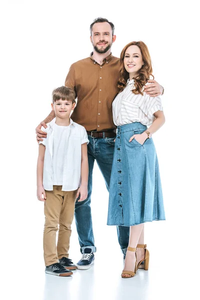 Full length view of happy family with one child standing together and smiling at camera isolated on white — Stock Photo