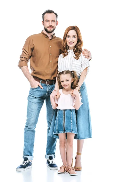 Happy parents with adorable little daughter standing together and smiling at camera isolated on white — Stock Photo