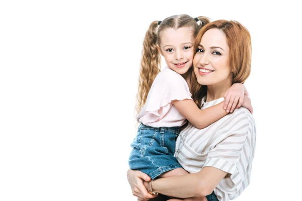 Beautiful happy mother and daughter hugging and smiling at camera isolated on white — Stock Photo