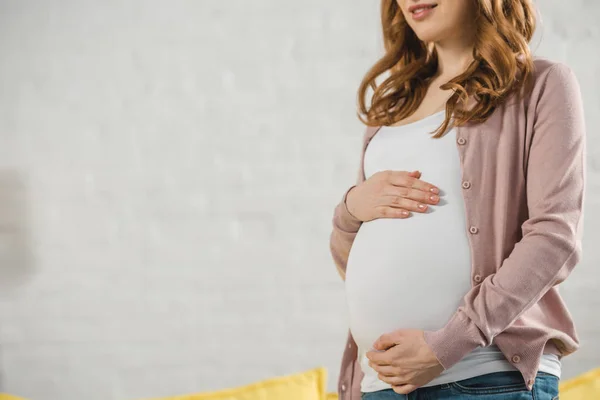 Touching belly — Stock Photo