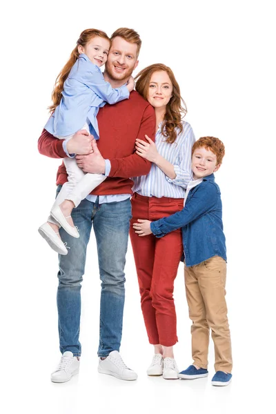 Beautiful happy family with two children smiling at camera isolated on white — Stock Photo