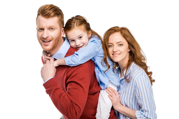 Happy parents with cute little daughter smiling at camera isolated on white — Stock Photo