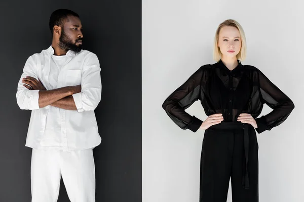 African american boyfriend standing with crossed arms and looking at blonde girlfriend — Stock Photo