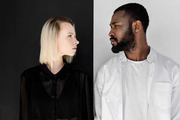 Side view of multicultural couple looking at each other — Stock Photo